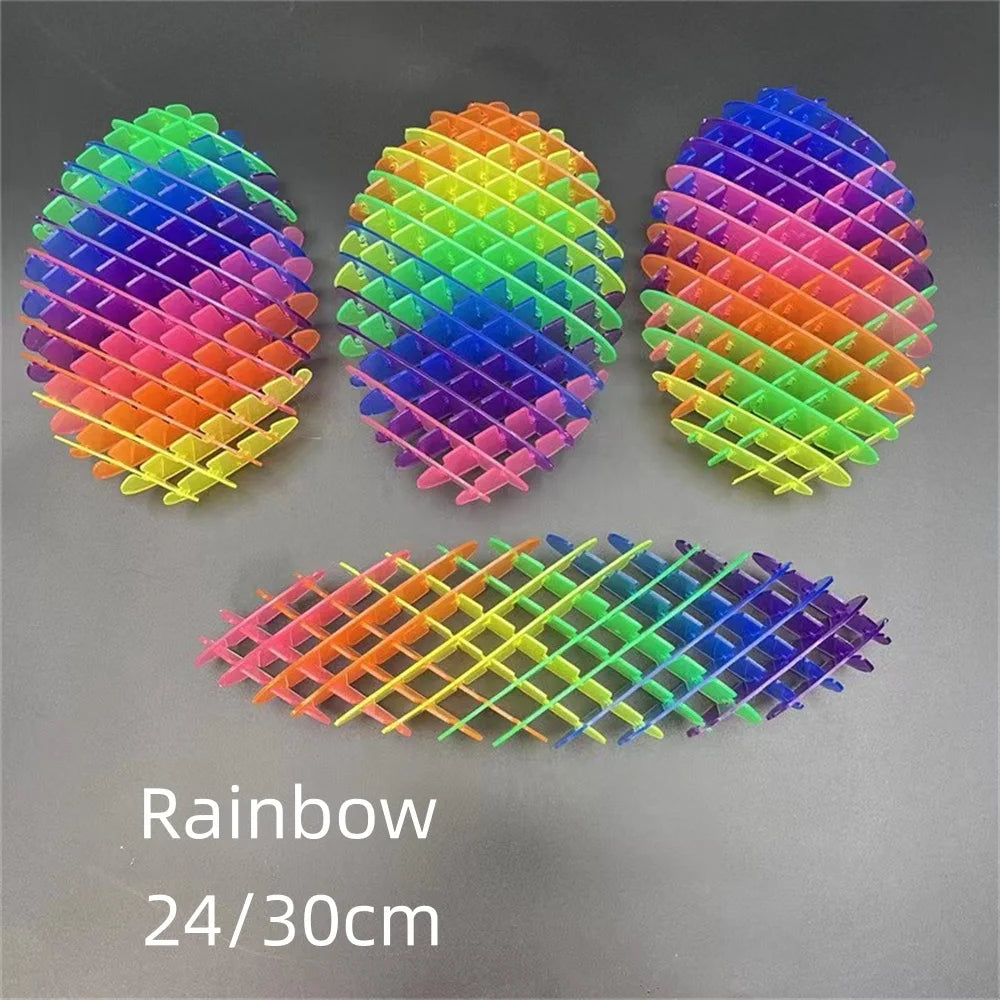 Set of colorful plastic egg-shaped objects with a grid pattern on a gray background.