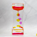 Colorful hourglass with pink, yellow, and purple accents on a white background