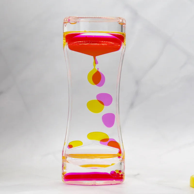 Colorful hourglass with pink, yellow, and purple accents on a white background